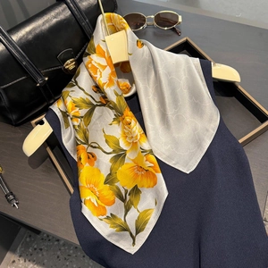 Luxurious pure silk square scarf featuring vibrant yellow floral prints and gray reverse