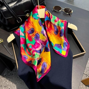 Vibrant 100% mulberry silk scarf with colorful abstract oil painting print on a hanger