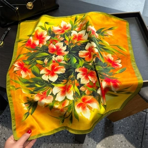 Elegant silk square scarf with realistic lily pattern and orange satin finish