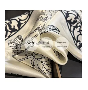 Close-up of soft breathable silk square scarf with vintage butterfly and floral prints