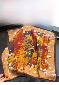 Detailed view of silk scarf with traditional Chinese cranes and garden prints