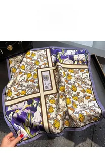 Detailed close-up of retro floral patterns on a pure mulberry silk square scarf scarf