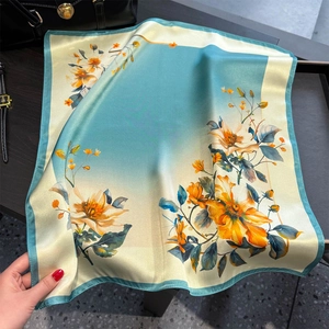 Elegant silk scarf with large floral print in teal and beige for spring and summer