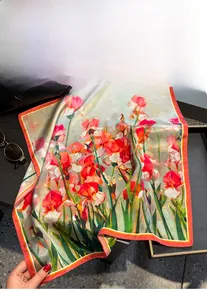 Detail of premium 100% mulberry silk square scarf with vintage floral print and smooth texture