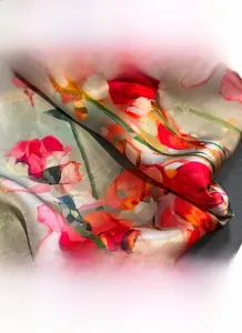 Close-up of the fine edge stitching and vibrant floral print on 100% mulberry silk scarf