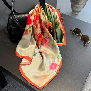 53cm luxury mulberry silk scarf with vibrant floral print on elegant black leather bag