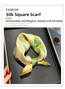 Detail of pure silk square scarf featuring traditional landscape print and glossy satin texture