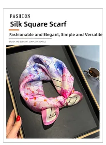 Detail of 100% mulberry silk square scarf with floral print and elegant glossy texture