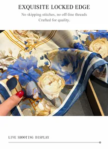 Close-up of fine hand-rolled edge on silk scarf with elegant blue floral pattern