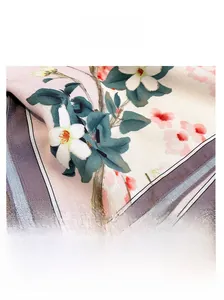 Detail of vintage floral silk scarf featuring double-sided colors and fine stitching