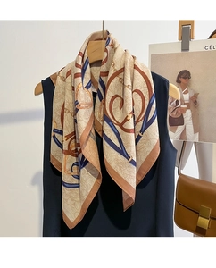 Detail of vintage square scarf with chain print and retro floral pattern in silk texture