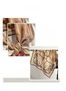 Detail view showing machine-stitched edges and elegant chain prints on silk-textured scarf