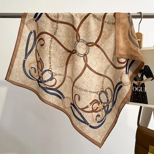 Retro square silk scarf with chain and paisley print in beige and brown hanging for display