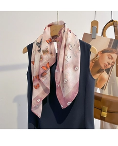 Detailed view of lightweight silk scarf featuring gradient purple and butterfly print