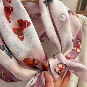 Elegant silk scarf with colorful butterfly print and soft texture for women