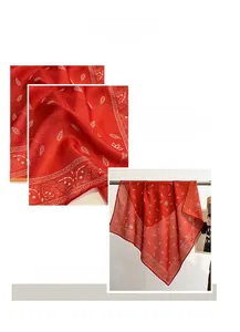 Macro shot of red paisley silk scarf showing refined machine-stitched edges and fine fabric