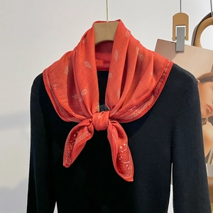 Elegant red paisley silk scarf for women featuring bohemian floral print and a smooth finish