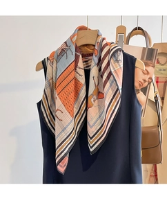 Detailed view of the equestrian print scarf with elegant horse motifs and modern patterns