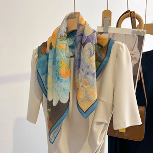Elegant floral silk square scarf in sky blue and orange with dark blue borders