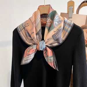 Elegant horse print square scarf in vintage equestrian style on black sweater
