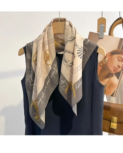 Detailed view of lightweight nautical print silk scarf with rope and anchor patterns