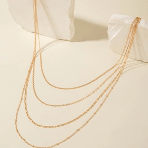 Minimalist multilayer gold chain necklace for women featuring layered styling and four strands
