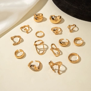 15-piece chunky gold ring set featuring irregular lava lines and teardrop designs