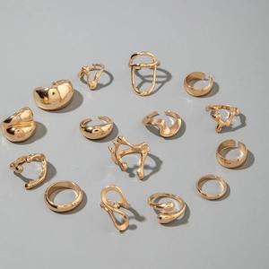 Macro shot of a 15-piece gold lava textured and irregular droplet rings jewelry set