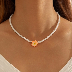 Summer beach style beaded necklace featuring a white plumeria flower resin pendant for women