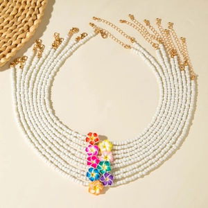 9-piece set of white beaded necklaces with colorful plumeria flower pendants for beach style