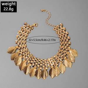 Detail view of bohemian gold fringe anklet with leaf charms showing 22cm length size