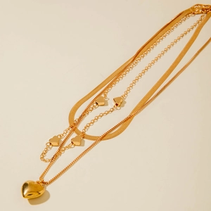 Three-layer gold snake chain necklace featuring elegant heart pendants and layered design