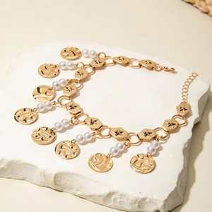 Bohemian gold layered anklet with star-engraved hex links, pearls and coin charms