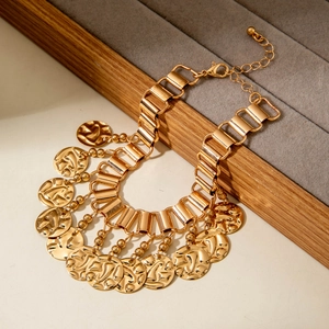 Vintage gold layered anklet with tassel leaf pendants and bohemian ethnic texture
