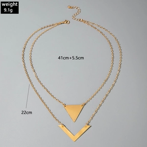 Detail view of double-layer gold geometric necklace with V-pendant and technical specs