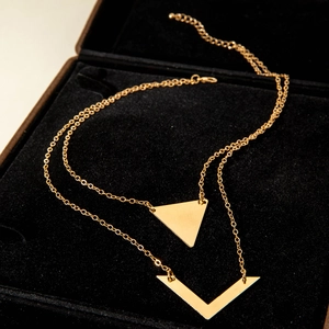 Elegant gold double-layer necklace featuring geometric triangle and V-shaped pendants