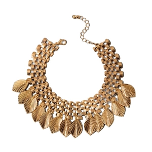 Bohemian gold layered leaf statement necklace with adjustable lobster clasp on white background