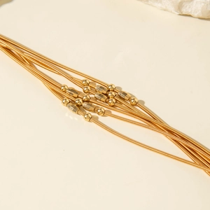 Bracelet chic multirangs en chaîne serpent dorée avec perles texturées et sphères polies