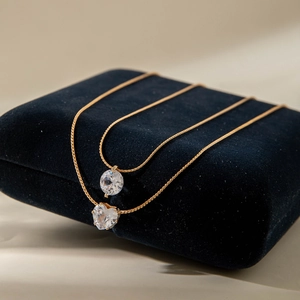 Fashion double-layer gold chain necklace with round and heart cubic zirconia pendants