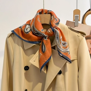 Classic paisley print cotton linen square scarf tied on a trench coat for women