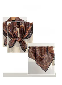 Detail view of the vintage mandala pattern and refined machine-stitched edges on silk scarf