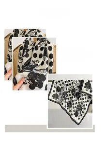 Detailed view of polka dot silk scarf featuring exquisite rose prints and machine-stitched edges
