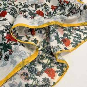 Elegant floral silk scarf for women featuring red flowers, green leaves and yellow edges