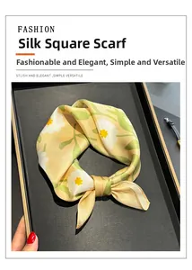 Detailed view of 100% mulberry silk square scarf with yellow floral daisy print