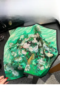 Detail of floral oil painting style silk scarf with green background and white flowers