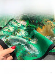 Close-up of fine hand-rolled edge on a 100% mulberry silk scarf with green floral print