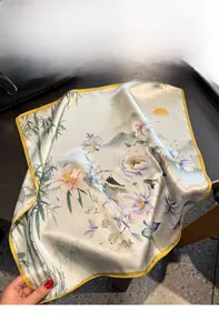 Detailed view of 100% mulberry silk scarf featuring vintage floral and bird print patterns