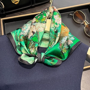 Silk neckerchief with Monet oil painting floral print worn on navy knit sweater