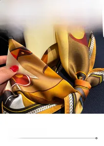 Detailed view of precise edge stitching on a geometric print silk-like scarf