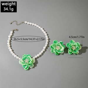 Detailed view of resin pearl necklace and floral earrings set with dimensions and weight
